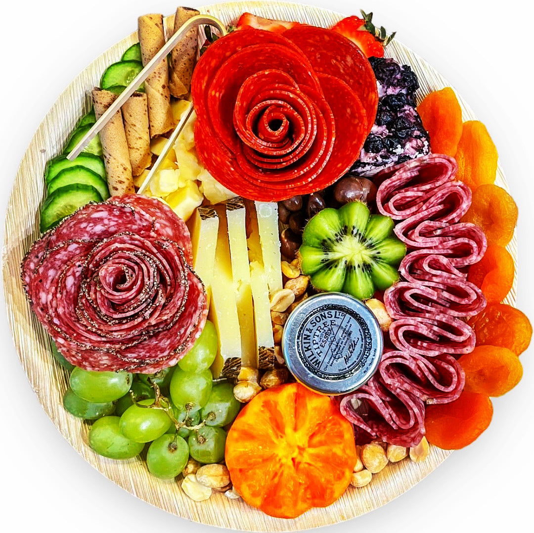 The Art of Designing a Beautiful Charcuterie Board on Palm Leaf Trays
